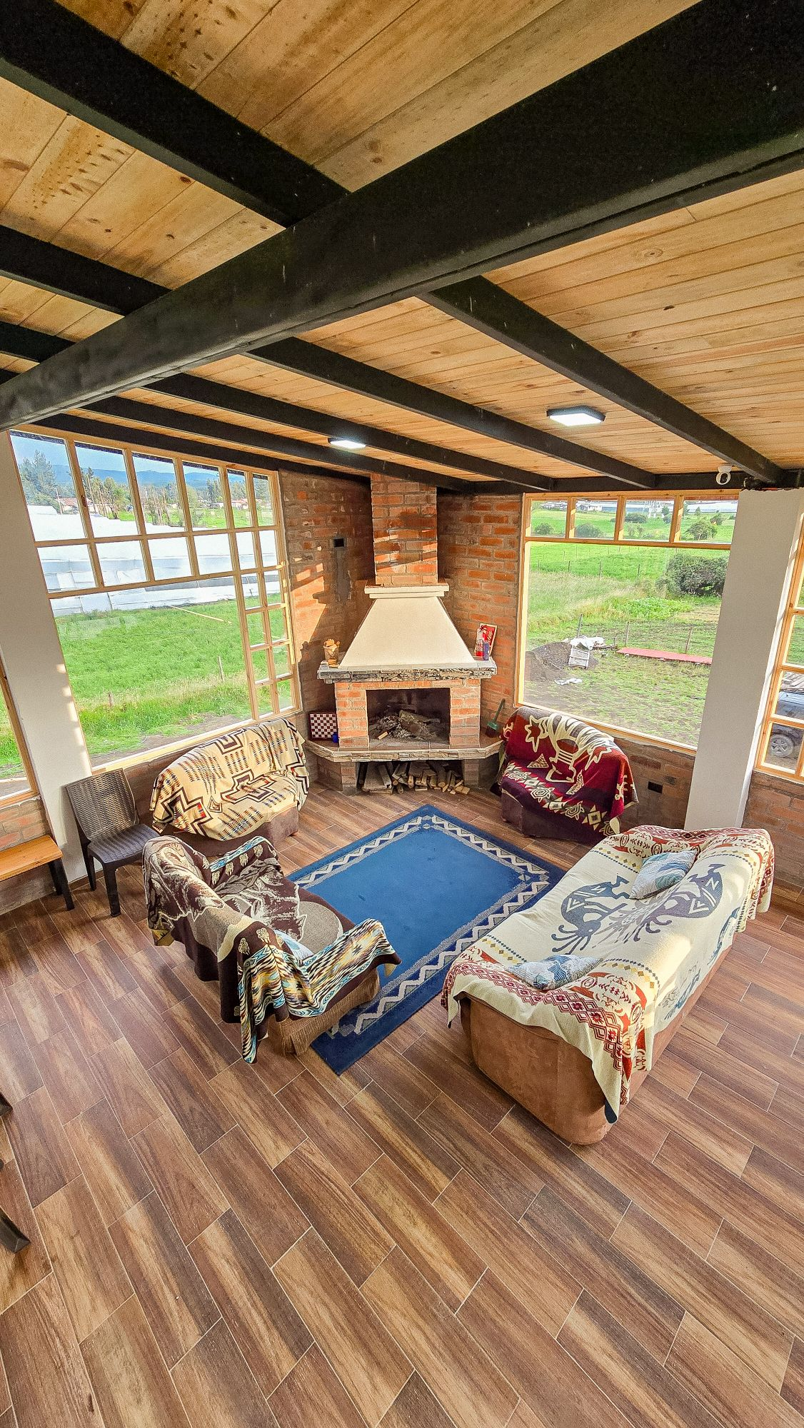 Cuscungo fireplace lounge with panoramic windows